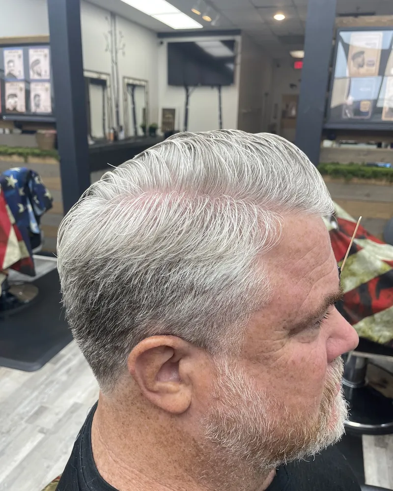 A silver-haired gentleman's cut, side profile