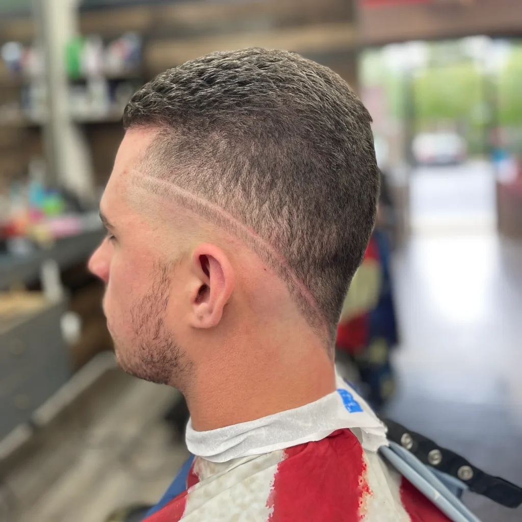Back of a buzz cut with a hard part shaved into the side