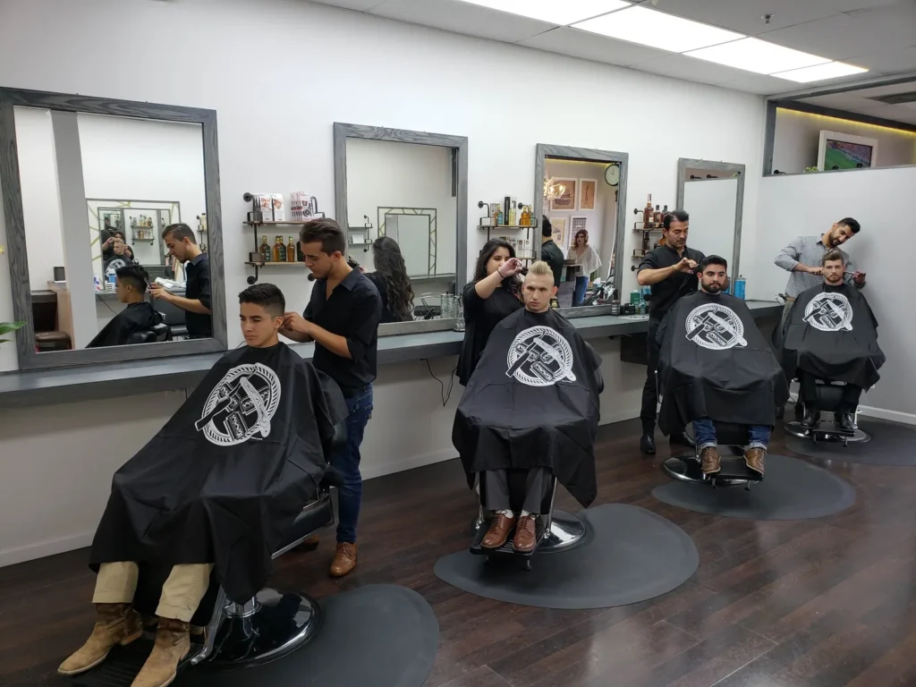 Four barbers cutting at the same time inside Milton Salon and Barber Shop, Alpharetta