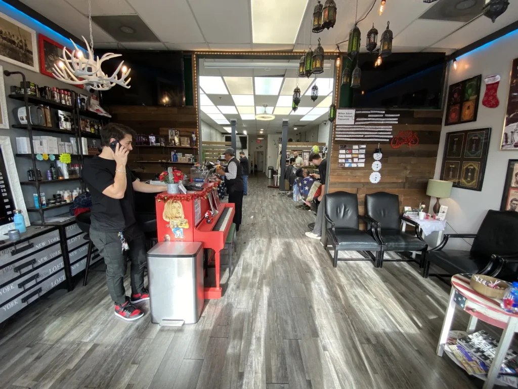 The length of the Milton Salon shop floor in Alpharetta: barber chairs on one side, the hair salon at the back